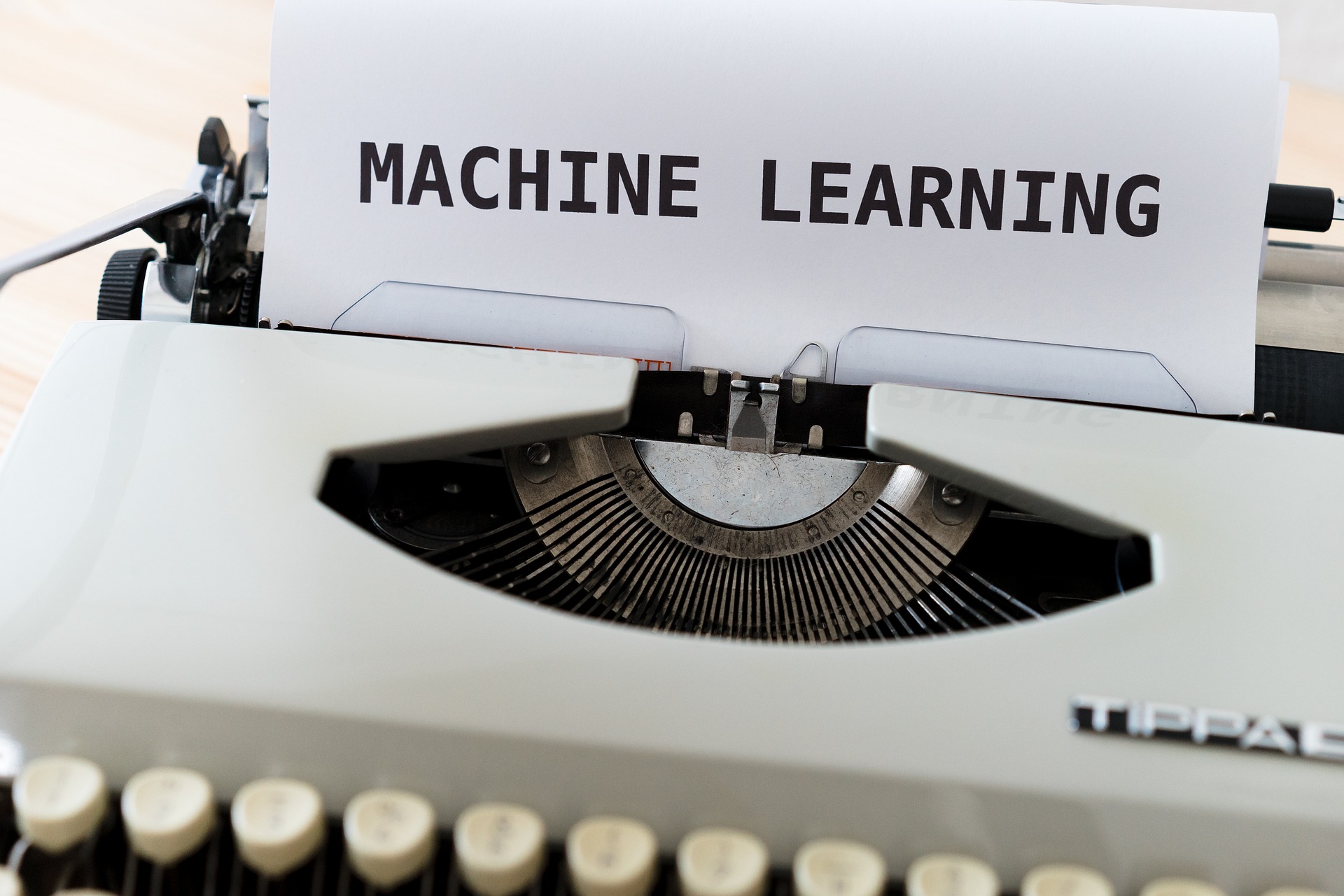 A typewriter with the text "Machine Learning" on the sheet.  Image by Markus Winkler from Pixabay 